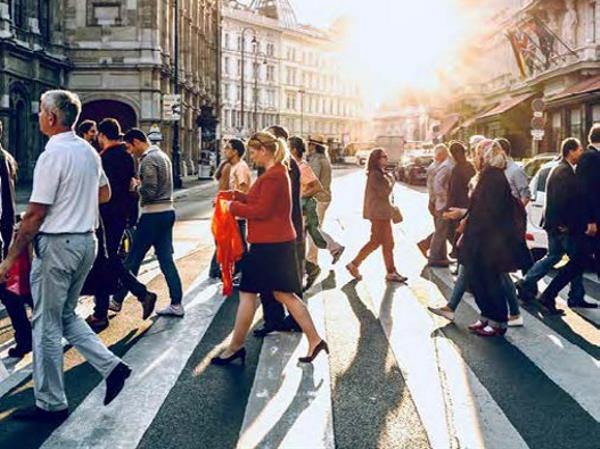 People walk through on a zebra crossing