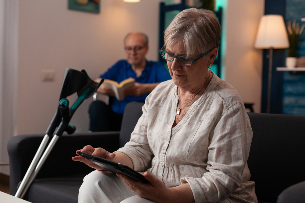 An elderly lady using an ipad