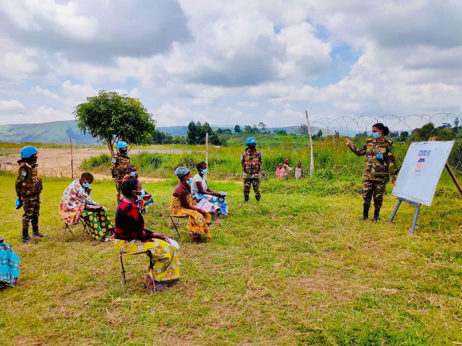 Group of people learning on a field