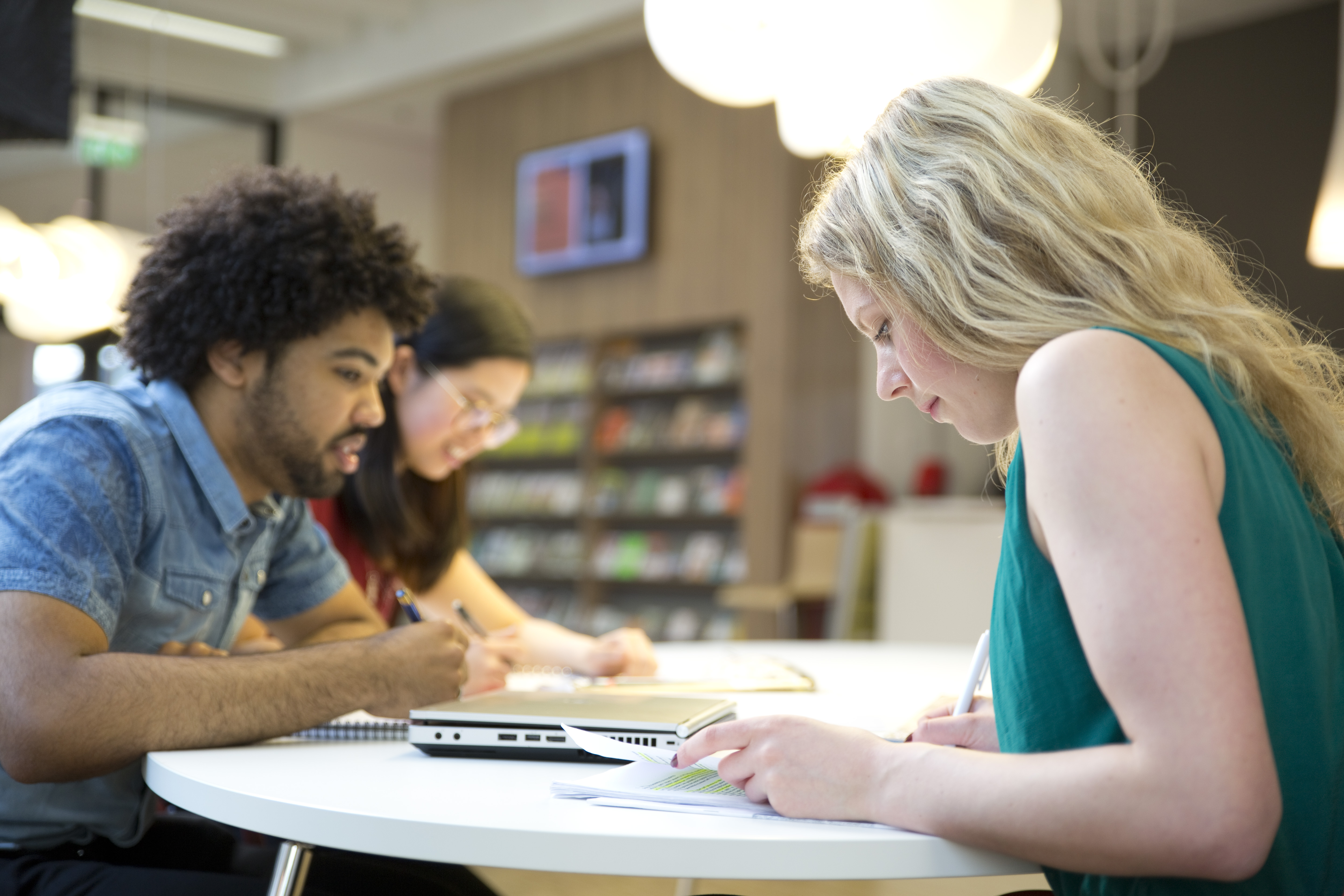 Students are working at a table