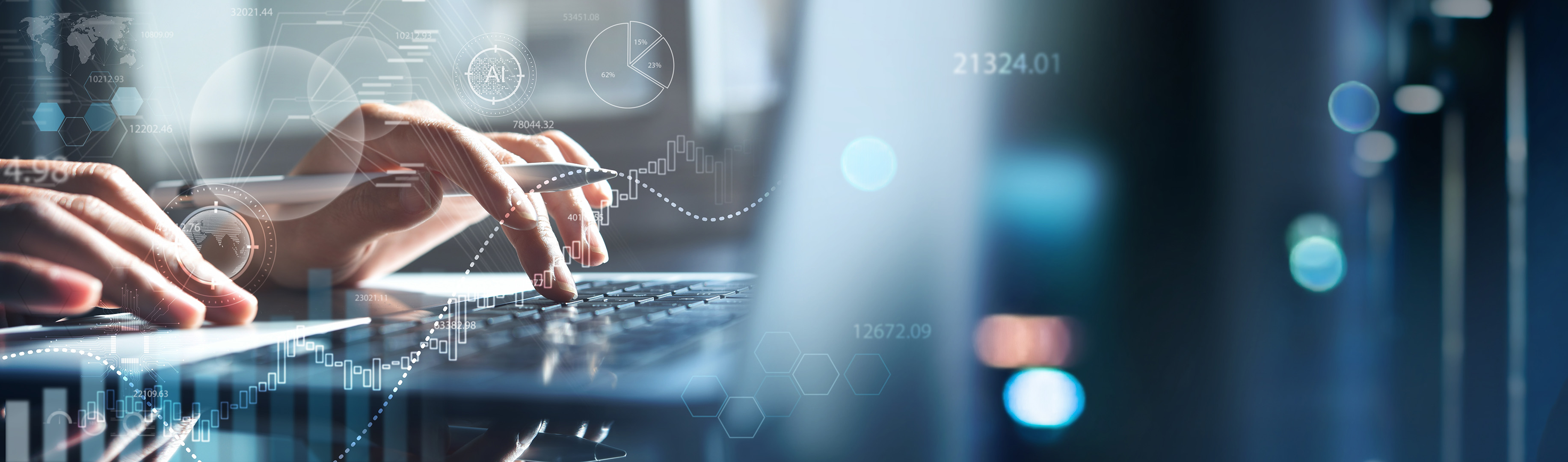 Programmer using laptop analyzing financial data on futuristic virtual interface